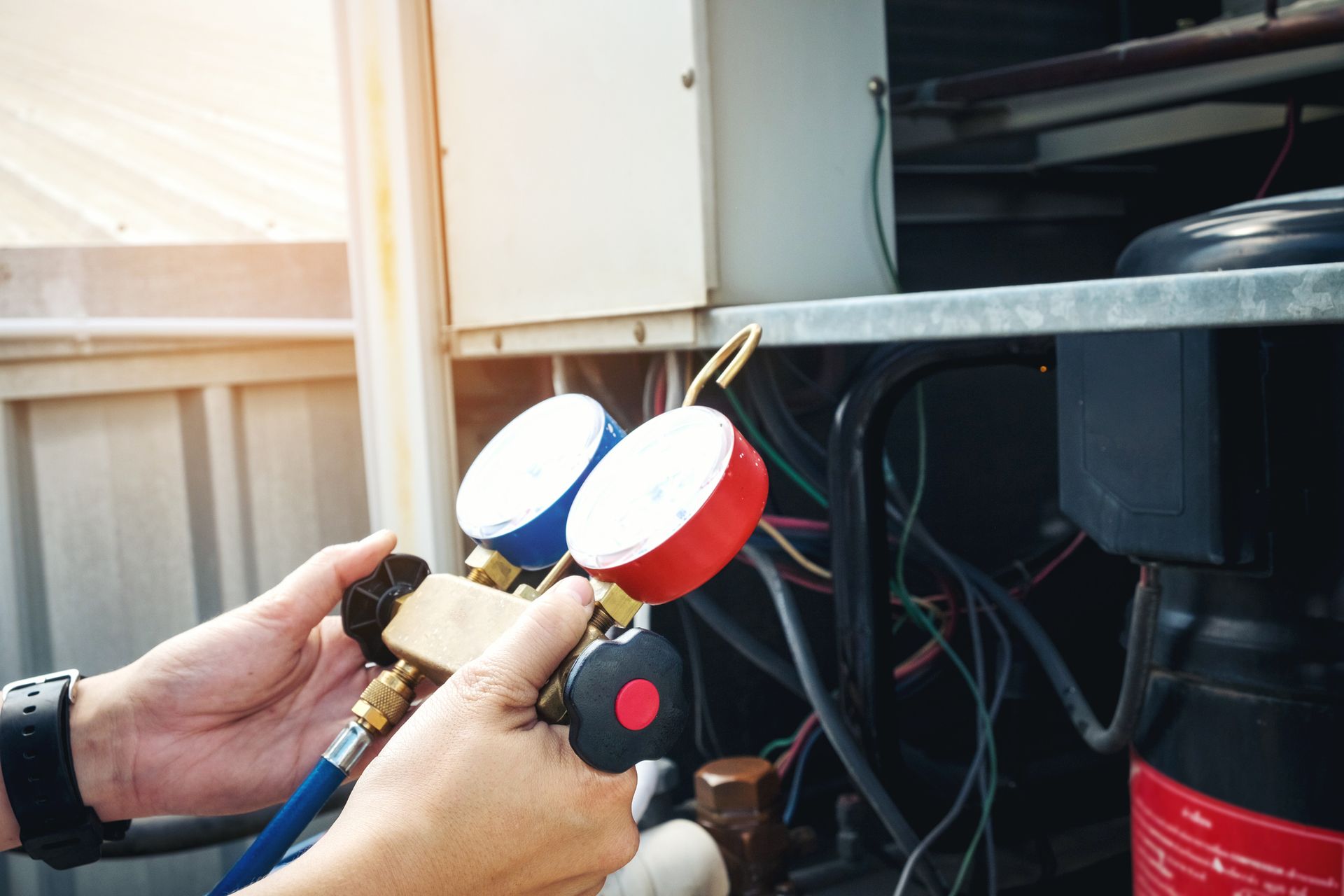 HVAC contractor technician inspecting an air conditioner unit for maintenance and repair service.