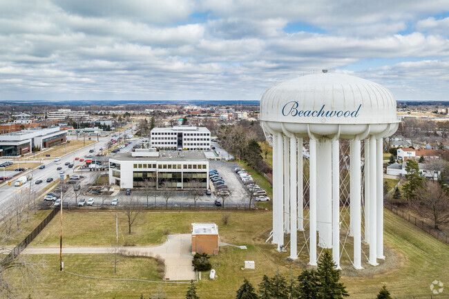 An aerial view of a water tower in a city.