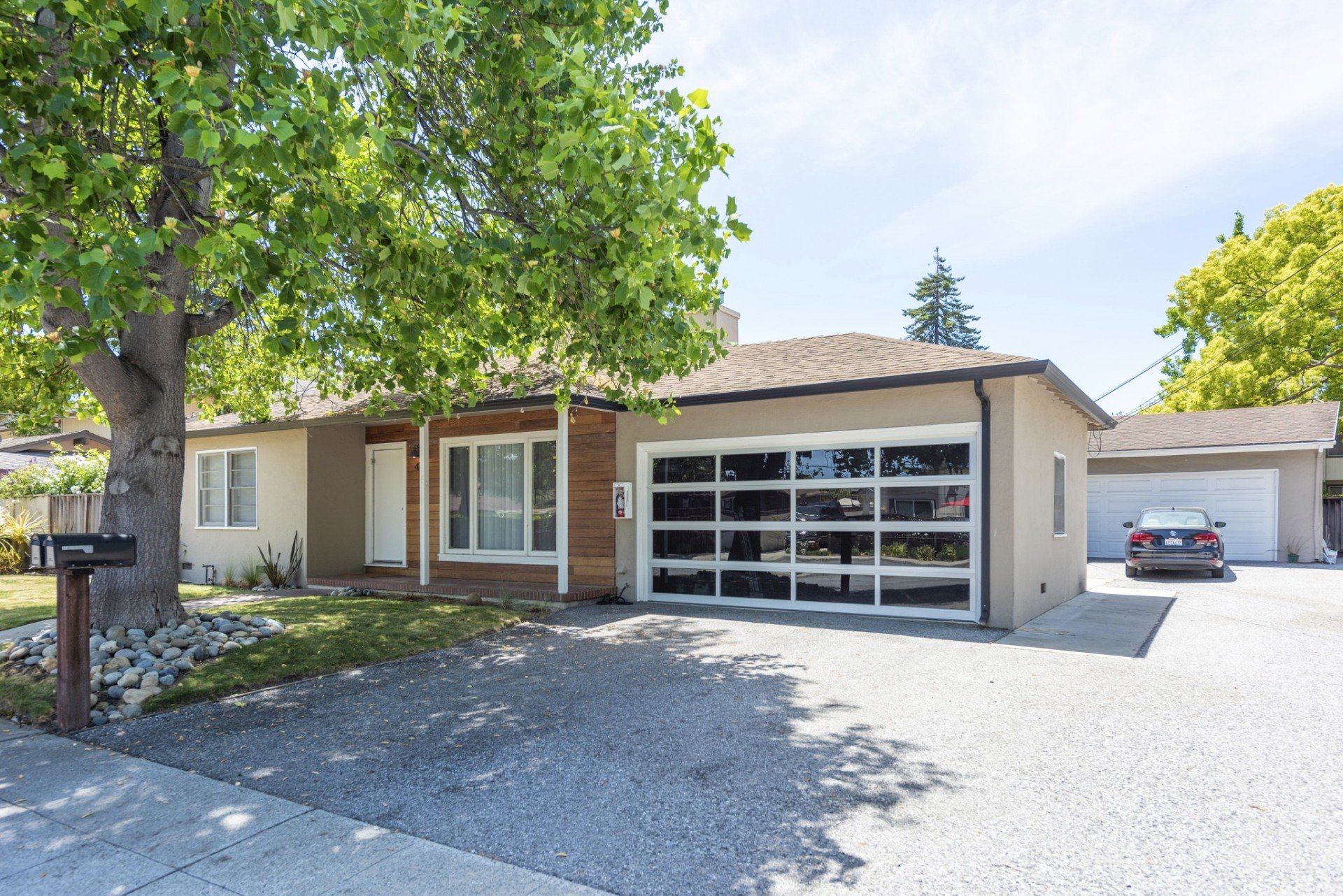 Exterior of one story house with garage