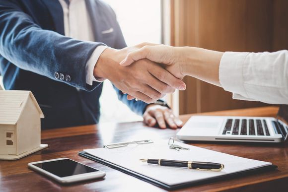 Agent and Customers Shaking Hands — Moorestown, NJ — LNB Commercial Capital