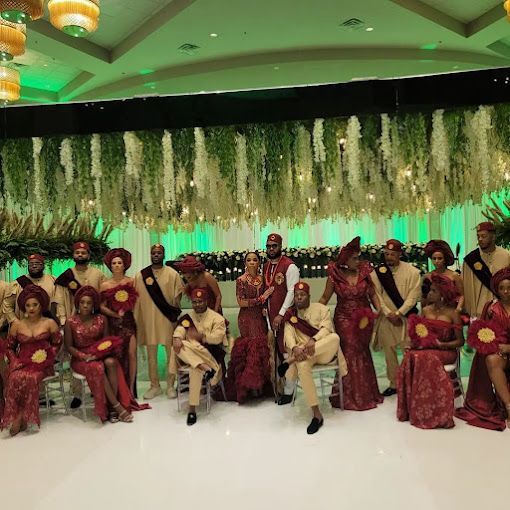 A group of people are posing for a picture in a room.