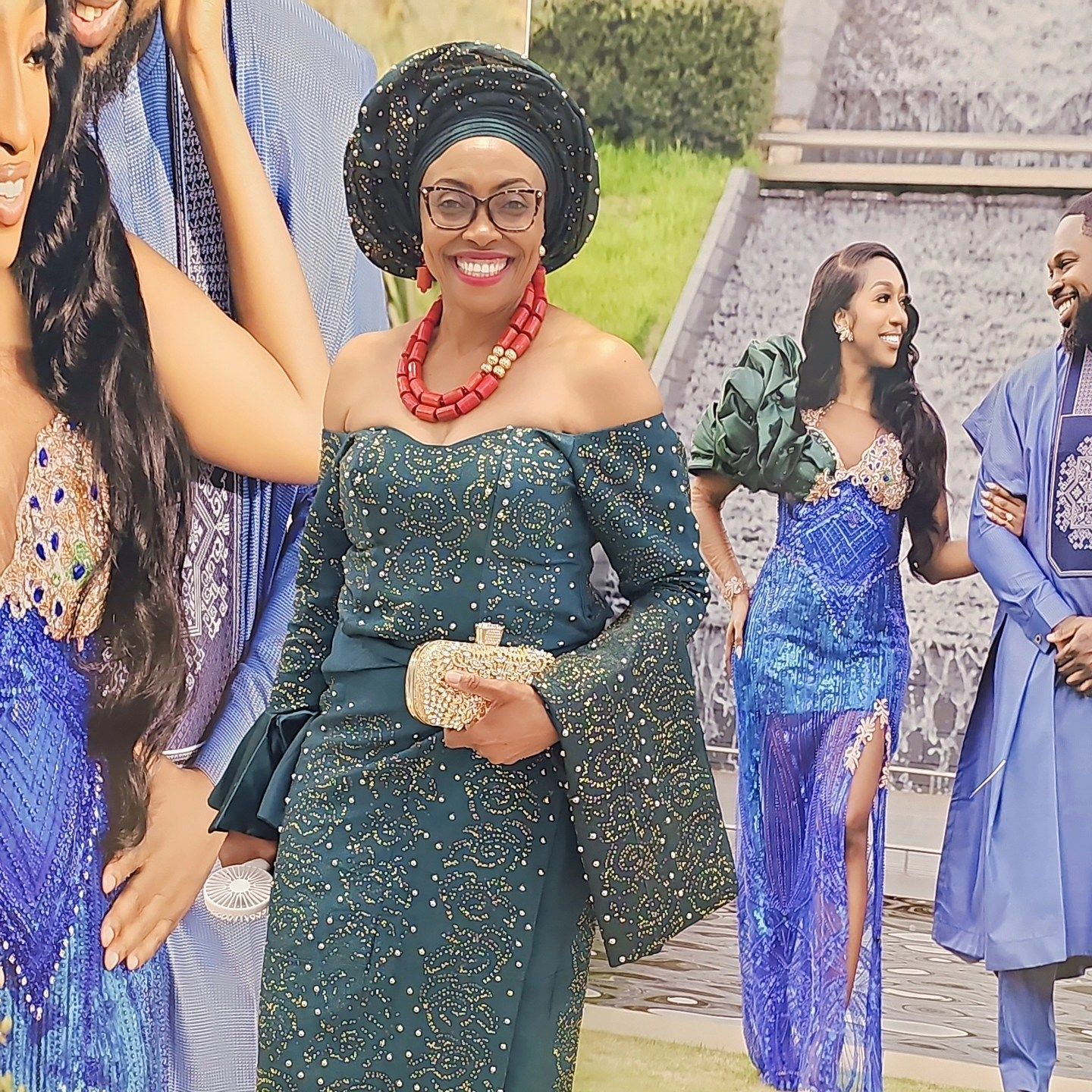 A woman in a blue dress is standing next to a man in a blue robe.