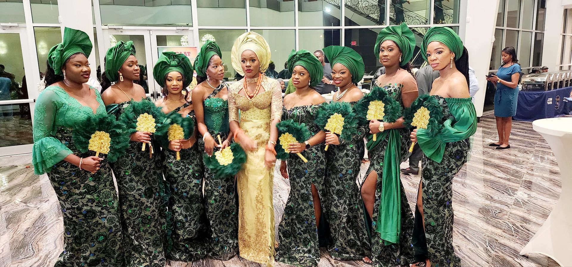 A bride and her bridesmaids are posing for a picture.