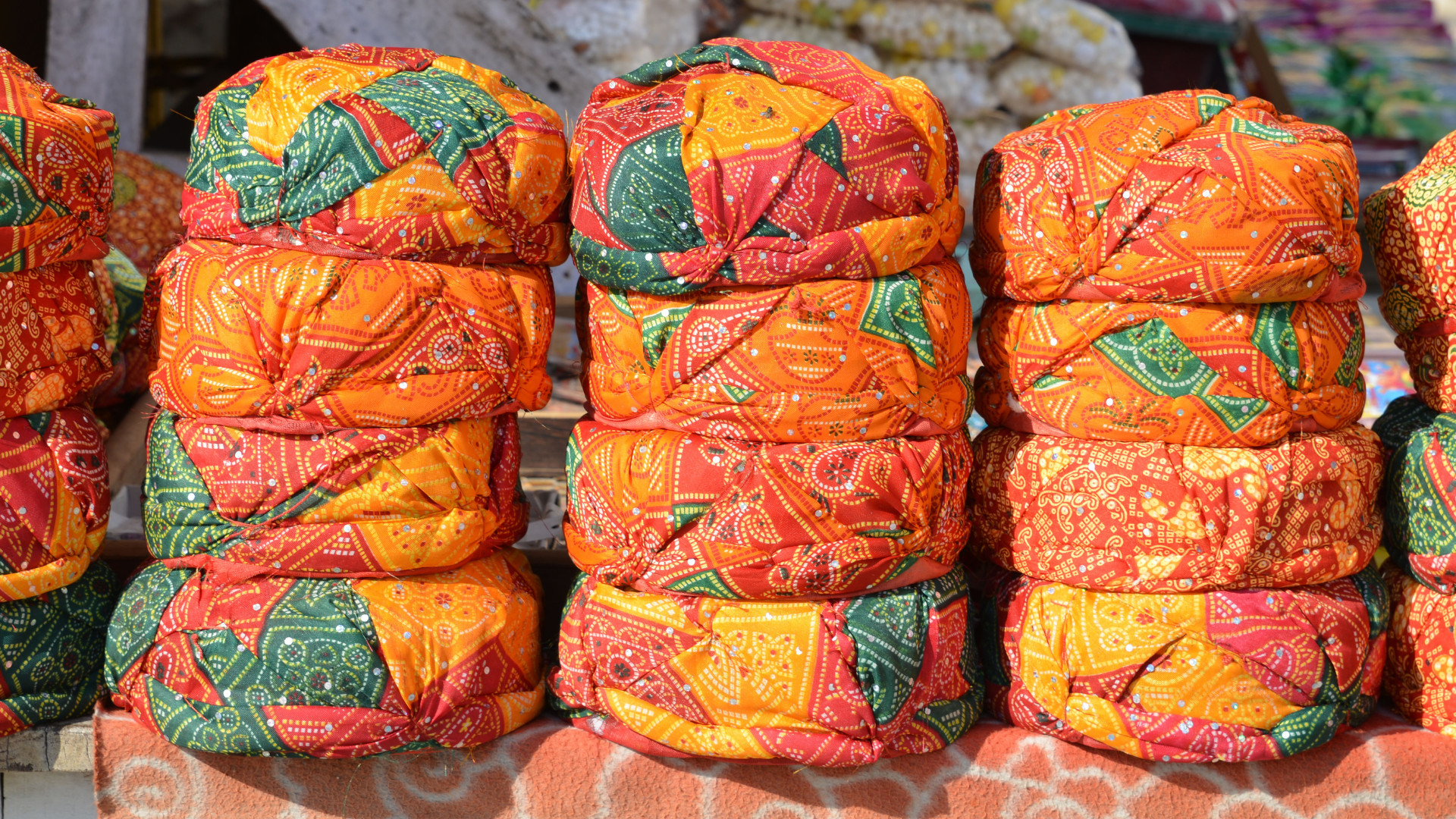 A bunch of colorful objects are stacked on top of each other on a table.