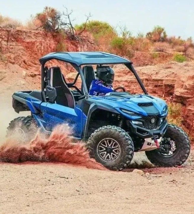 Driving a blue ATV