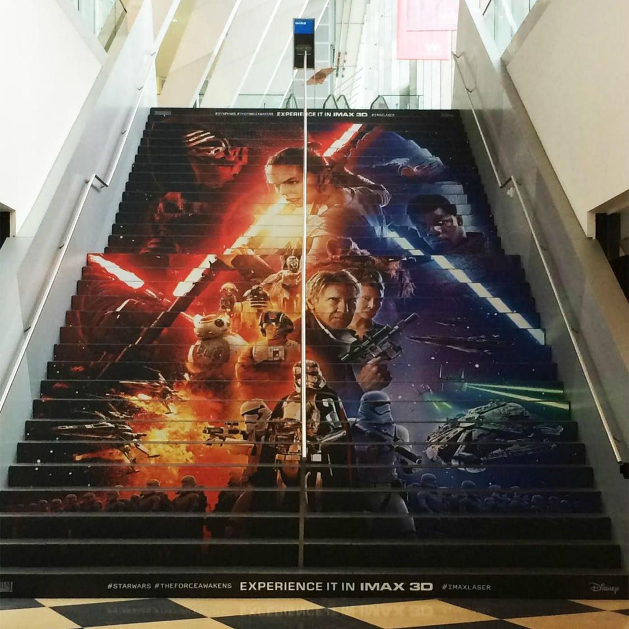 A staircase with a star wars poster on it