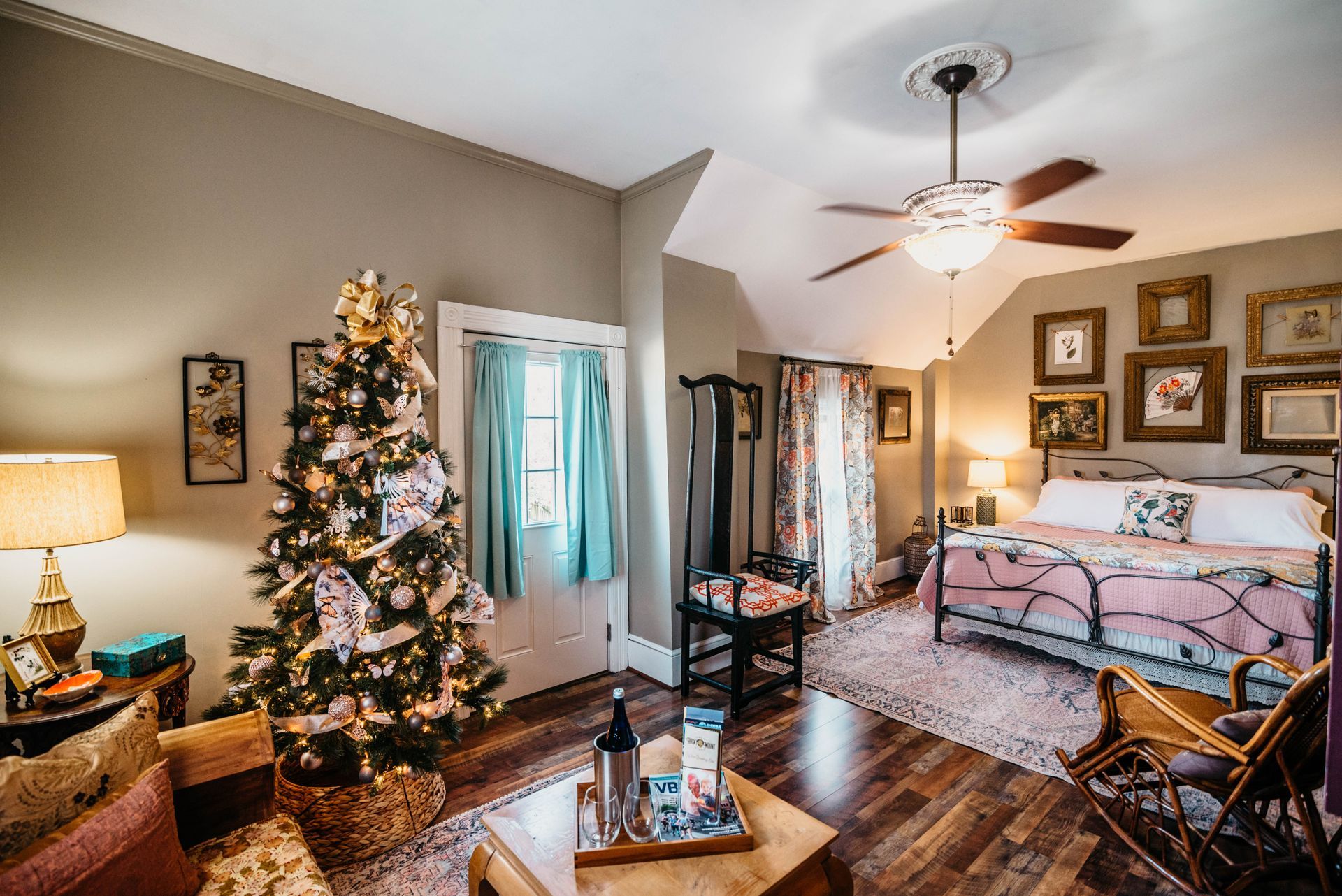 There is a christmas tree in the middle of the room.