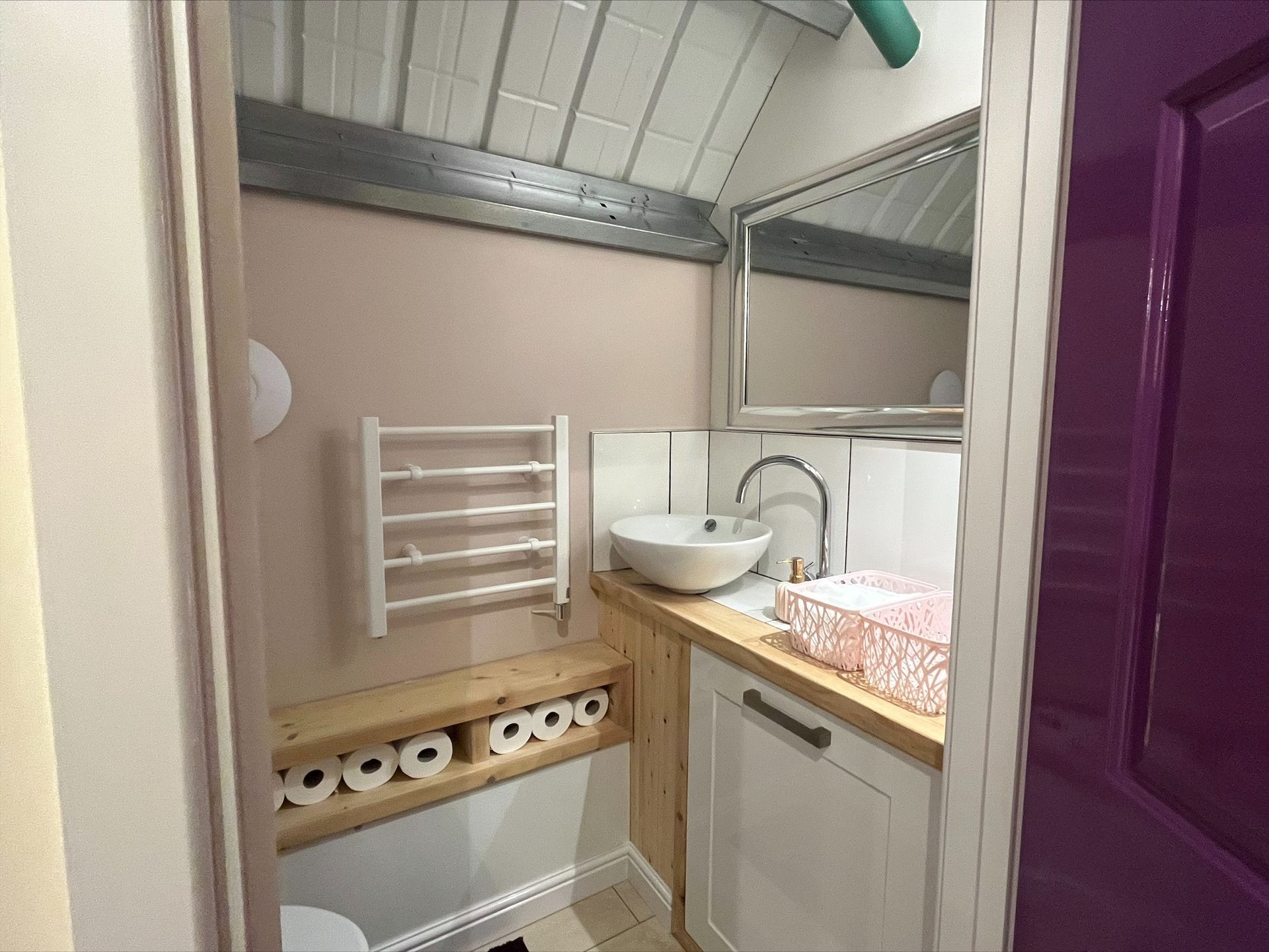 Deanslade bathroom with a sink , toilet and mirror.