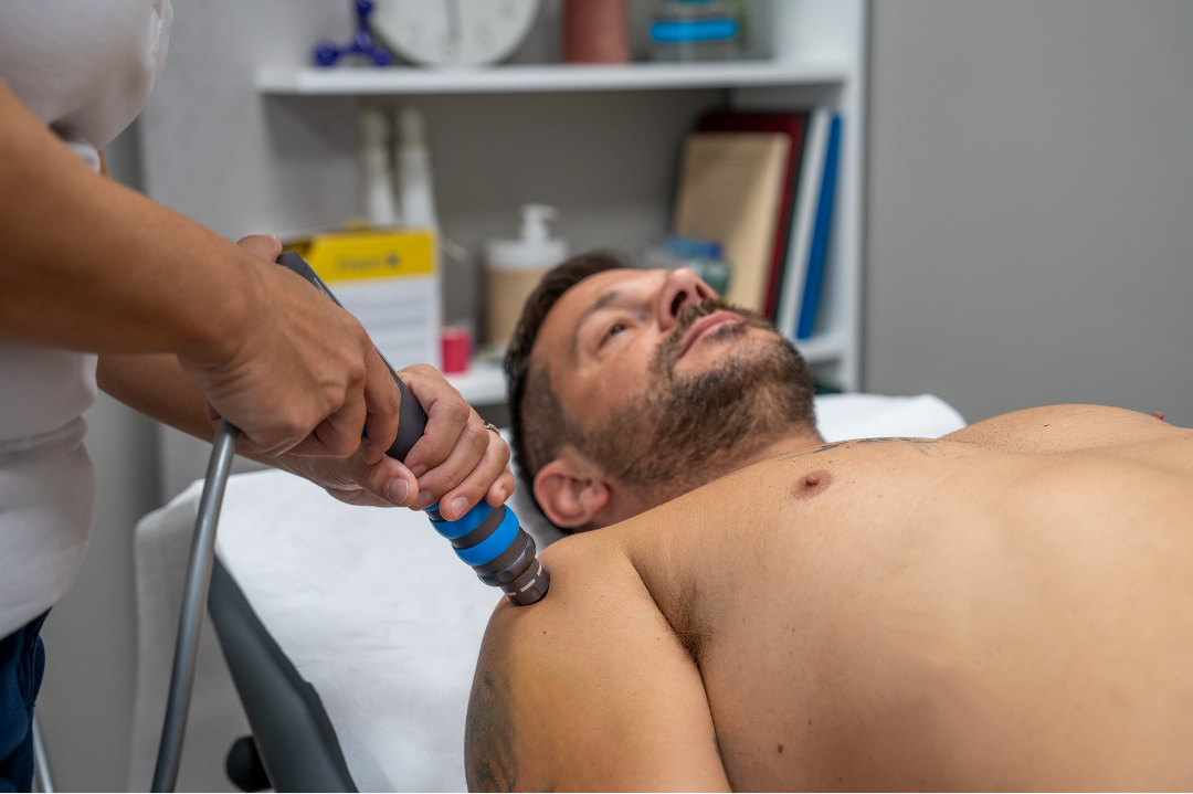 Shockwave therapy was applied to a patient’s shoulder for Calcific Tendonitis in Shefford during a clinical treatment session.
