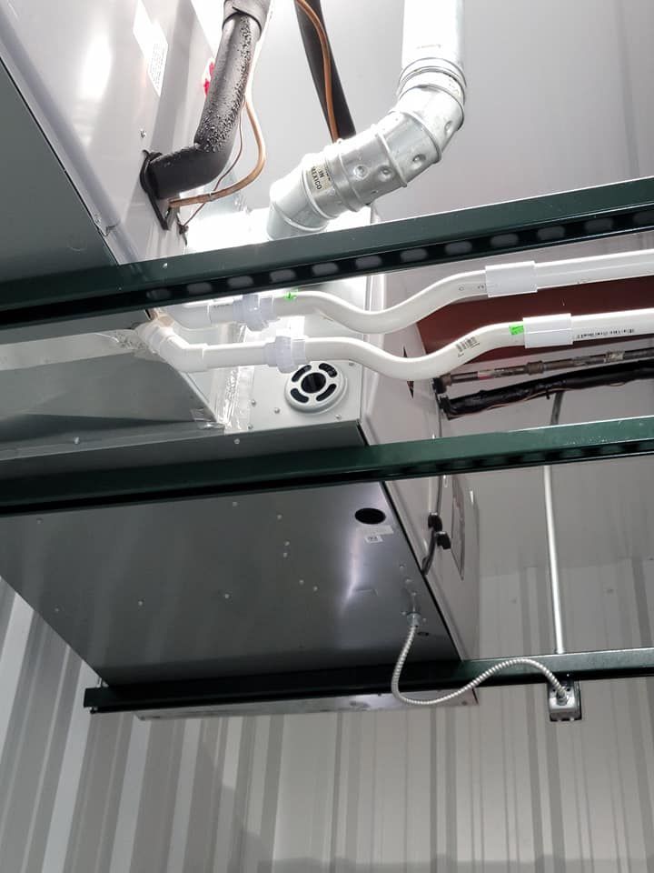 A close up of a pipe hanging from the ceiling of a building.