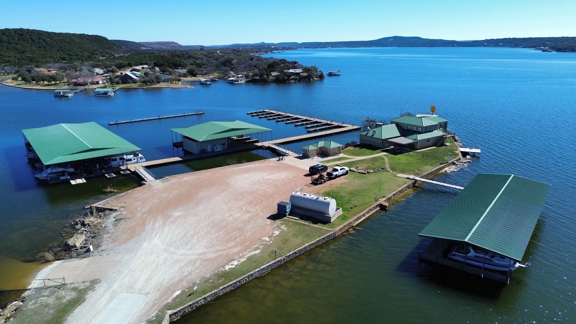 An aerial view of a marina on a large body of water.