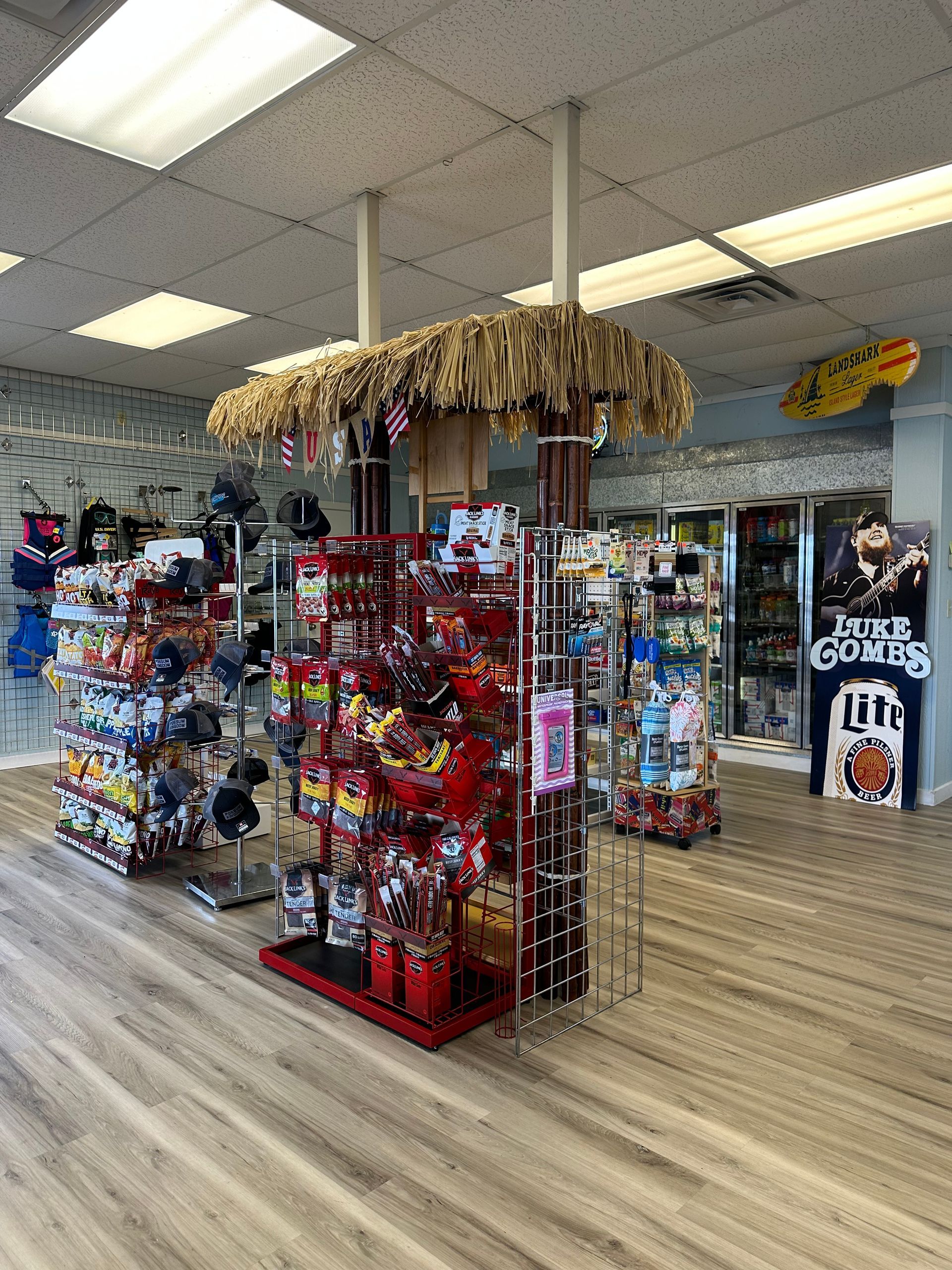 A store filled with lots of candy and a surfboard.