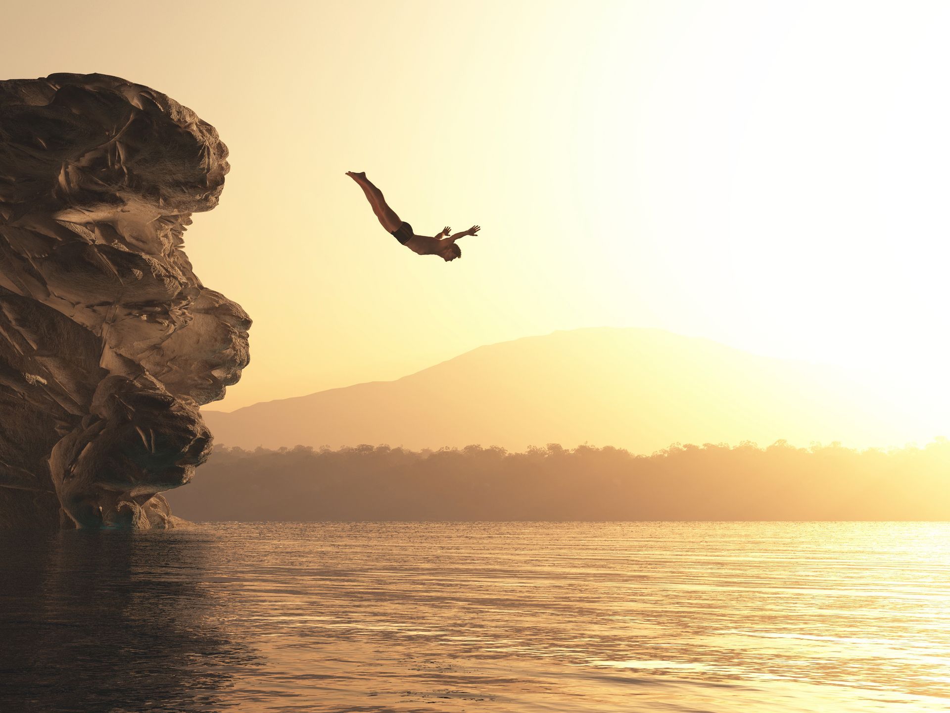 A person is jumping off a cliff into the water