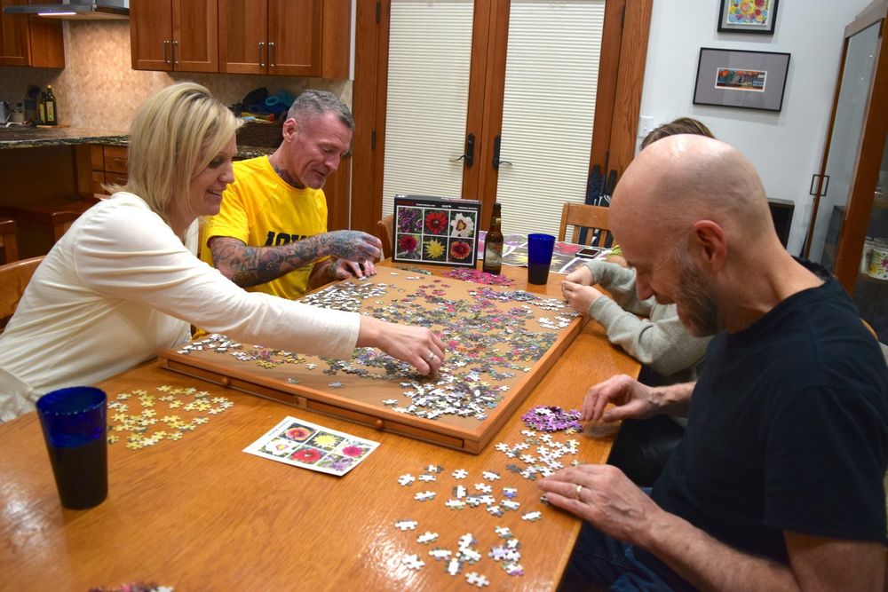 family putting together a puzzle
