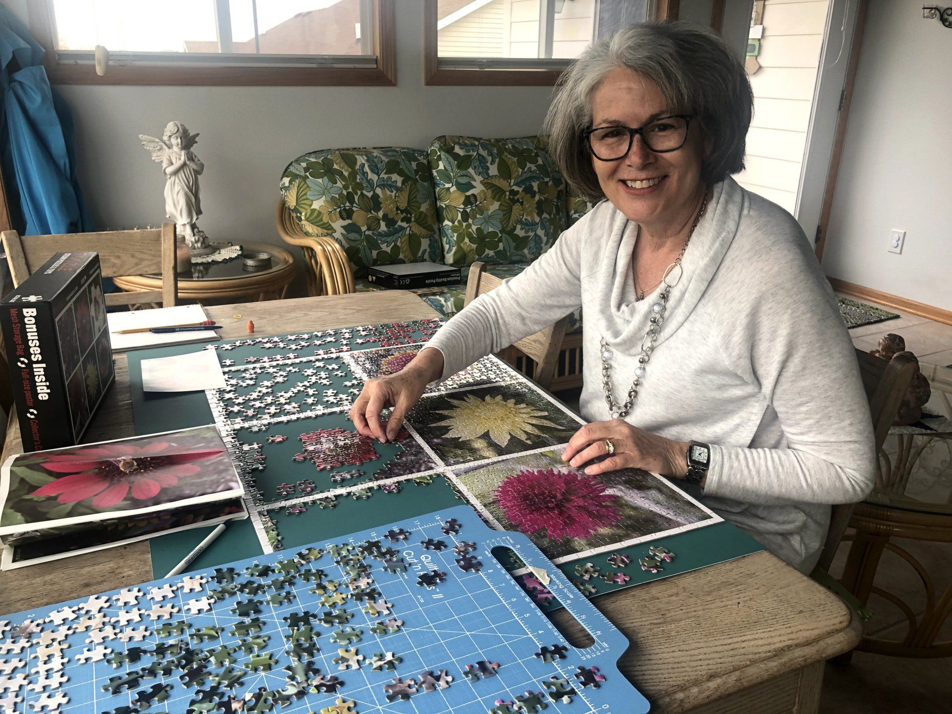 woman putting together Perennial Beauties Puzzle