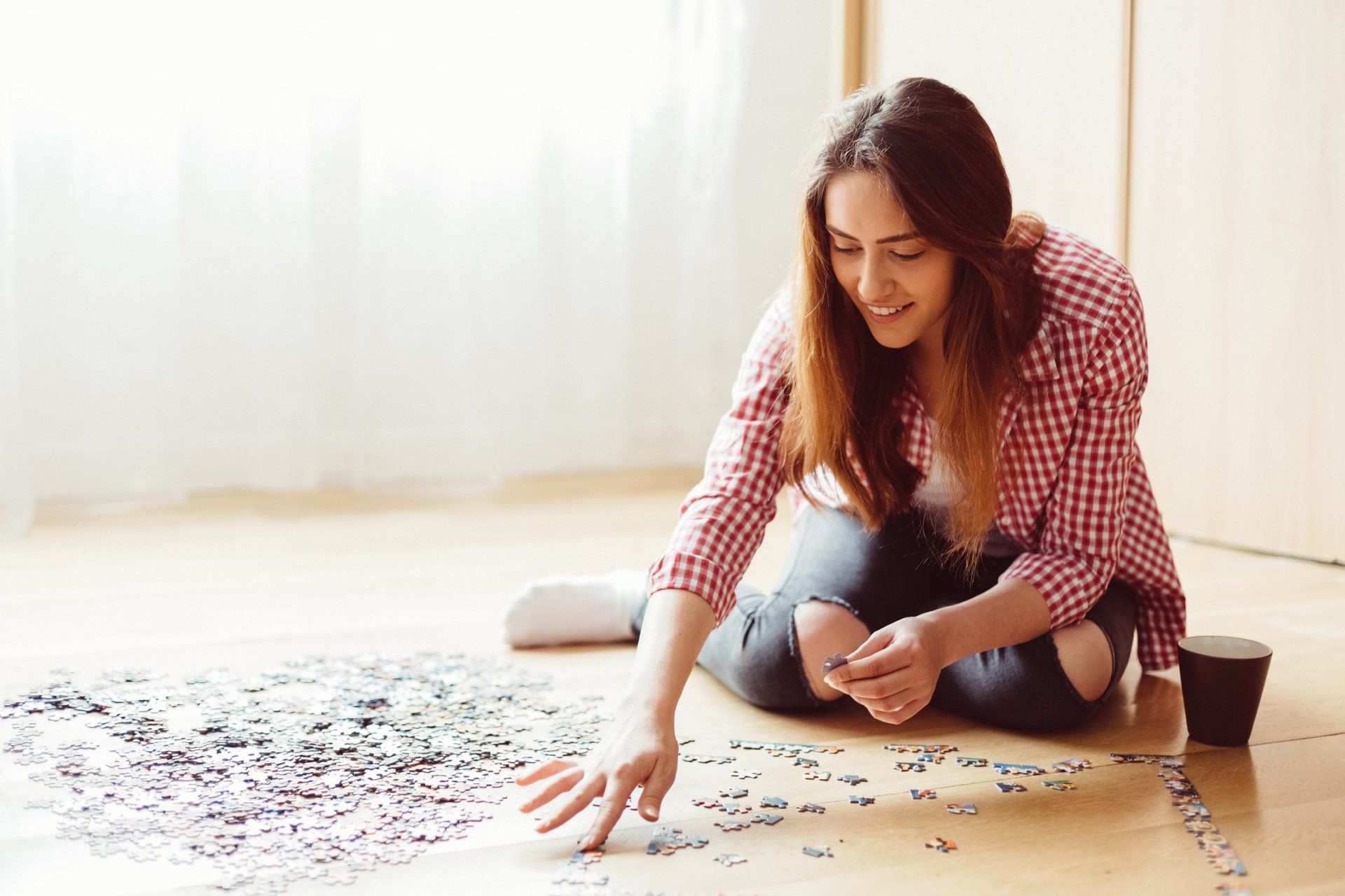 woman putting a puzzle together