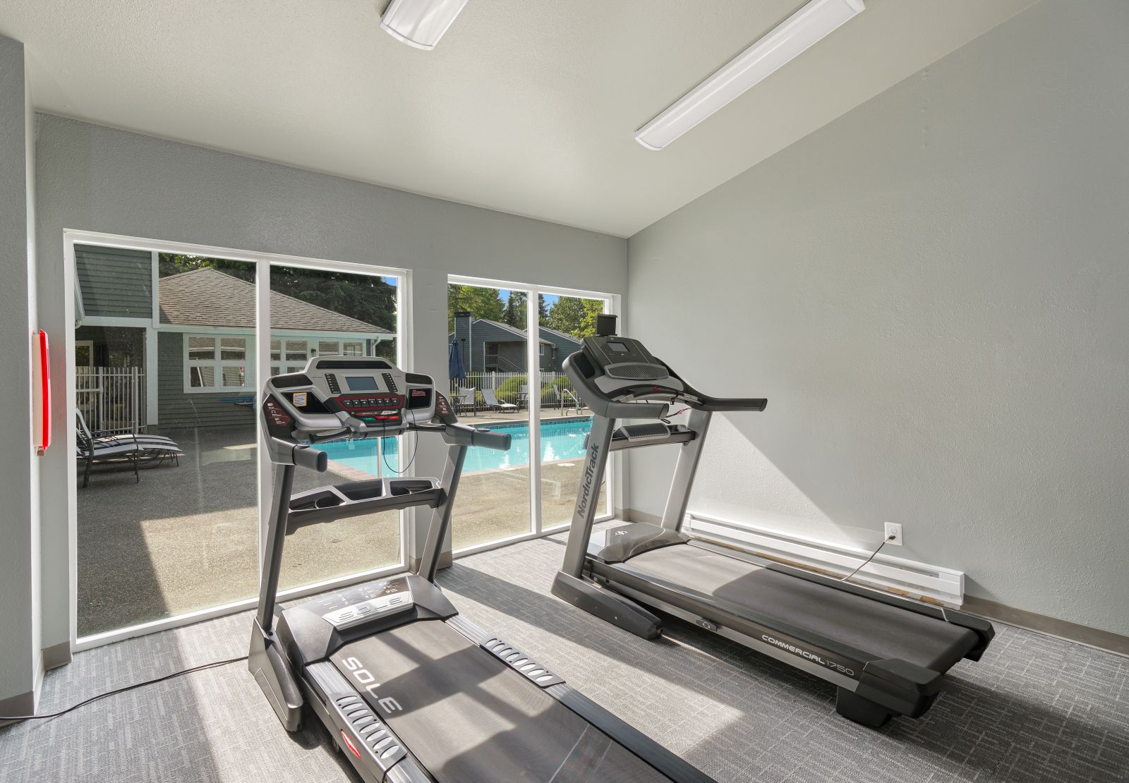 Fitness Center with view of pool