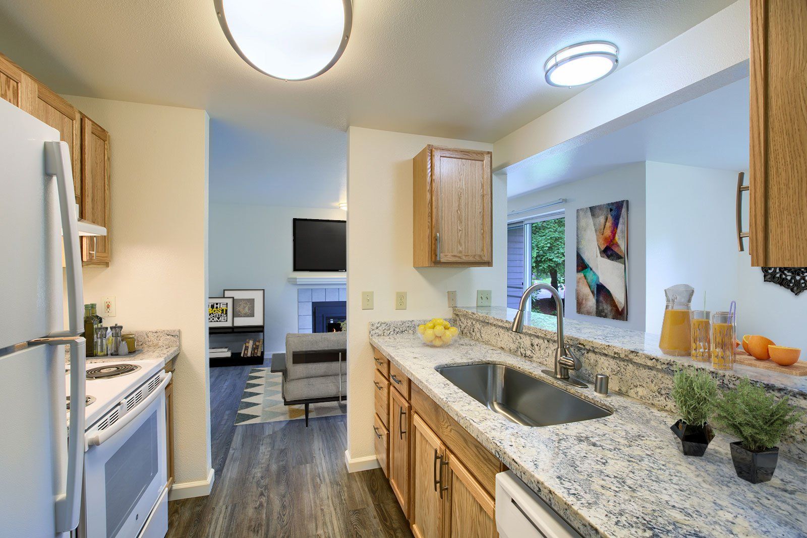 1x1 kitchen with view of living room - virtually staged