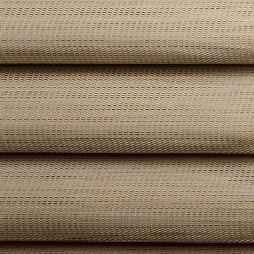 Close-up of stacked beige woven fabric rolls with horizontal ridges