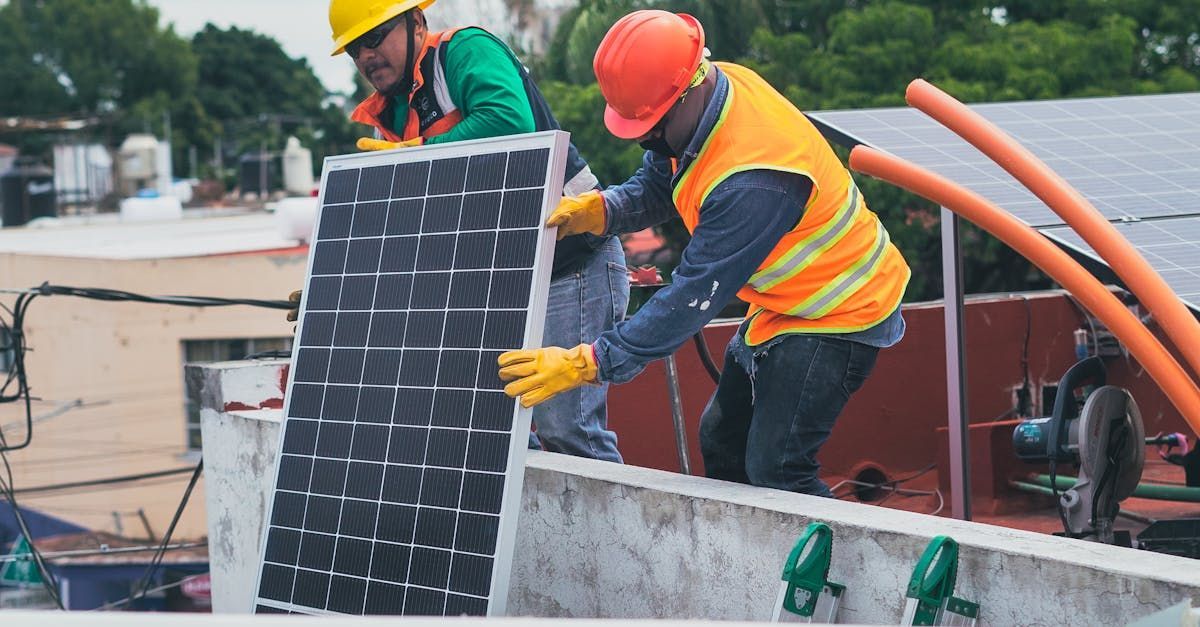 Dracut Solar technician conducting maintenance on solar panels in Tyngsboro, MA.