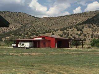 NEW - Lincoln NM irrigated farm with the Bonito Creek running through it - 2 metal barns, awesome well, electricity to property line.