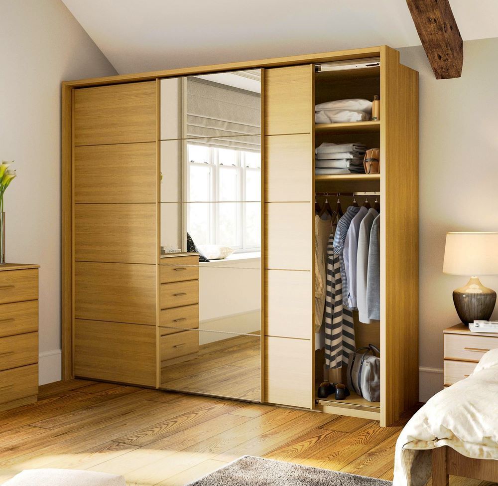 A Bedroom With a Large Wardrobe With Sliding Doors — Wardrobe World In Paget, QLD