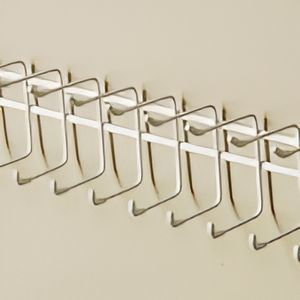 A Row of Hooks Are Hanging on a Wall — Wardrobe World In Paget, QLD