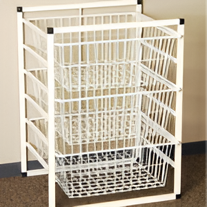 A White Laundry Basket is Sitting on a Carpeted Floor — Wardrobe World In Paget, QLD