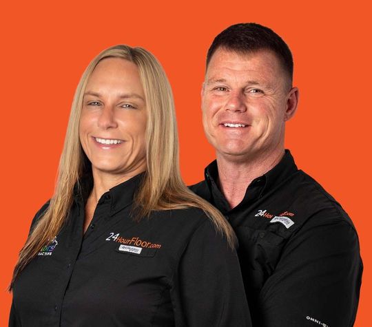 A man and a woman are standing next to each other on an orange background.