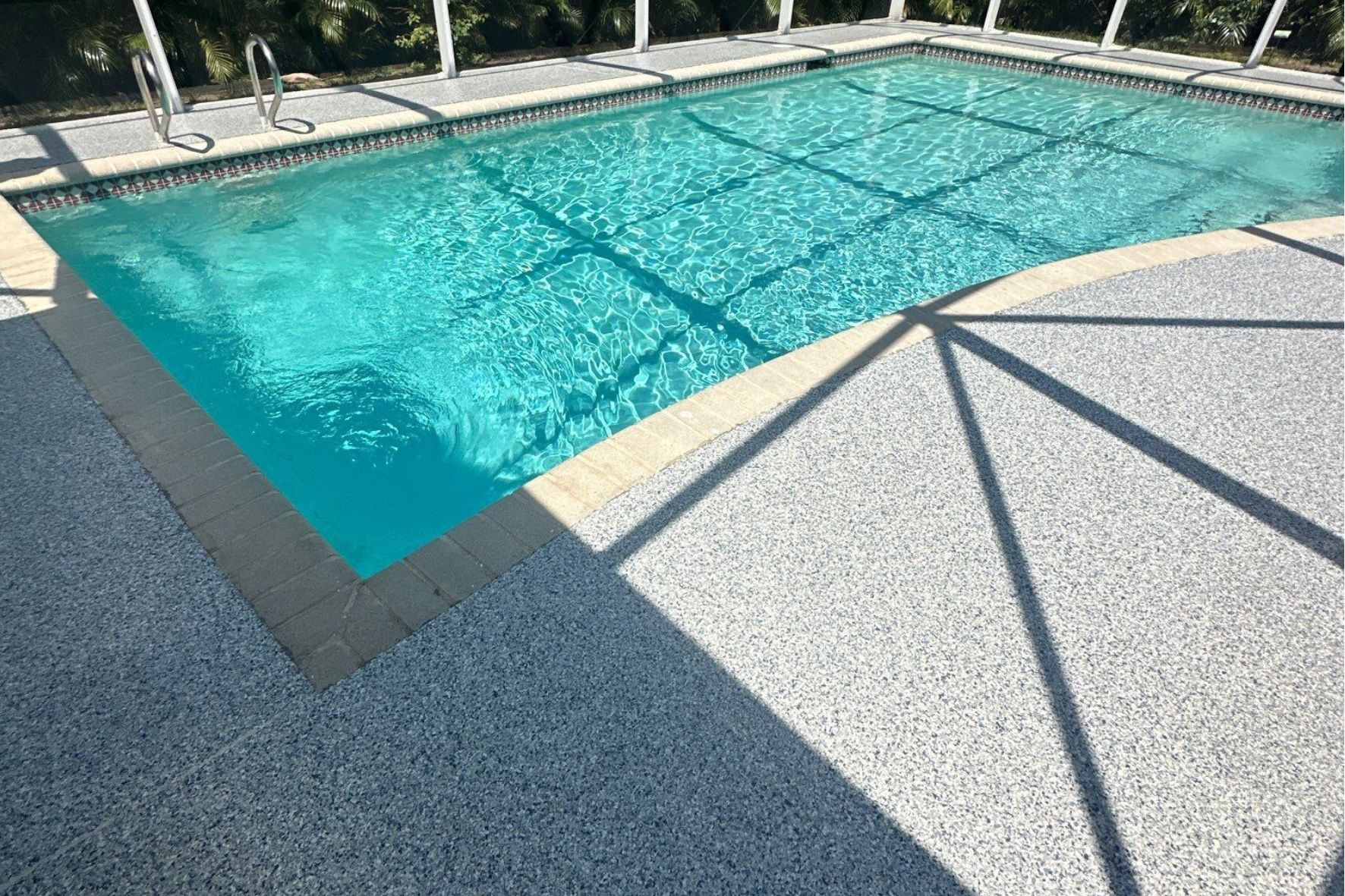 Shimmering pool with 24 hour floor pool deck