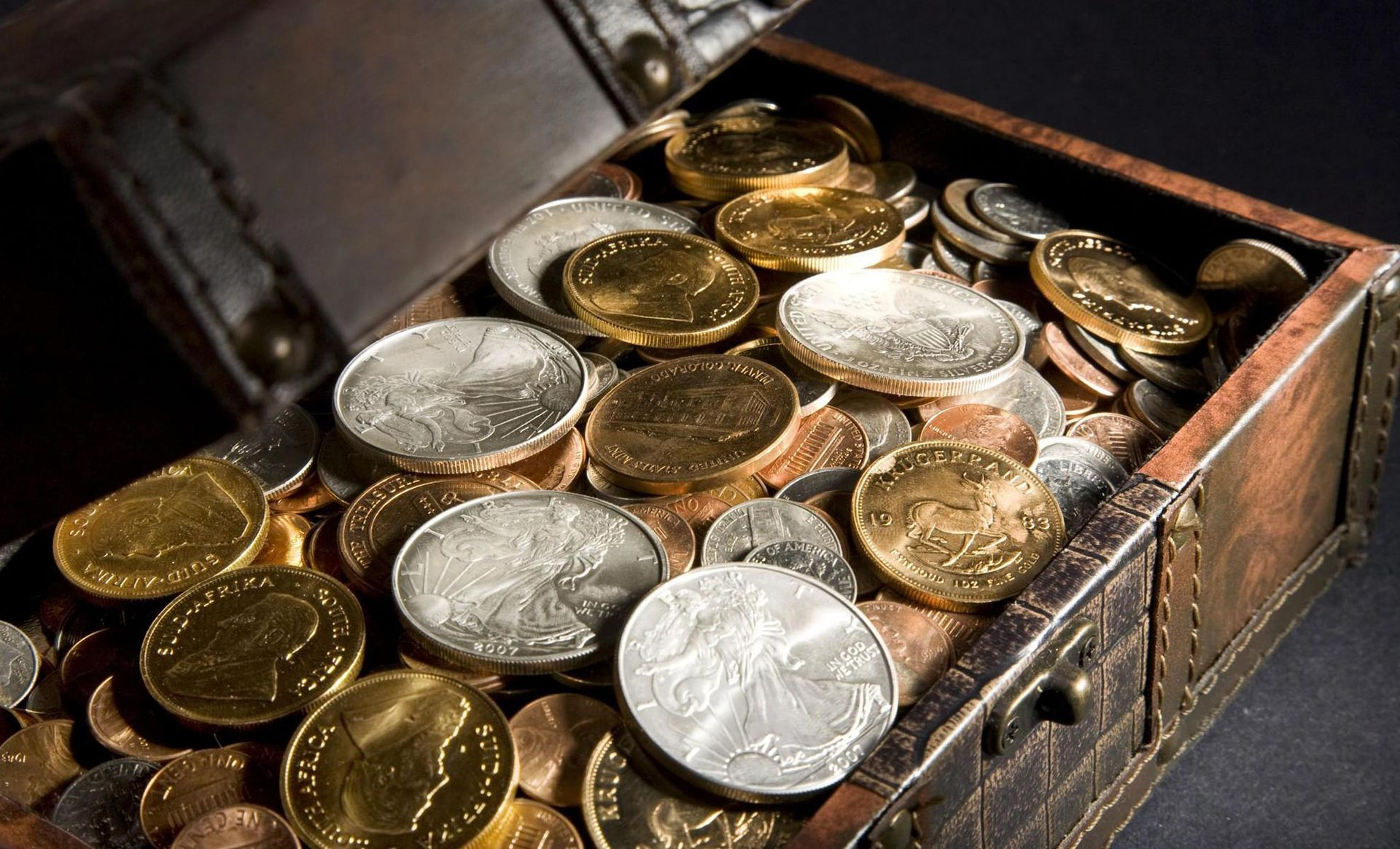 A treasure chest filled with gold and silver coins