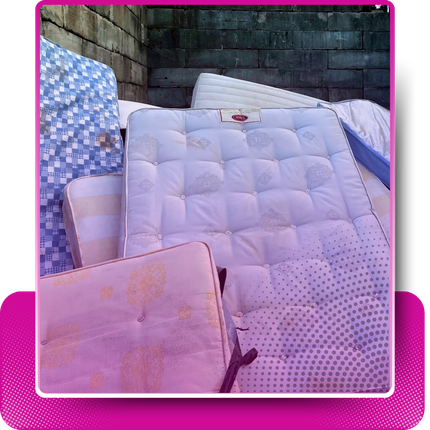 A pile of discarded mattress with faded pink gradient and a rectangular shape behind it.