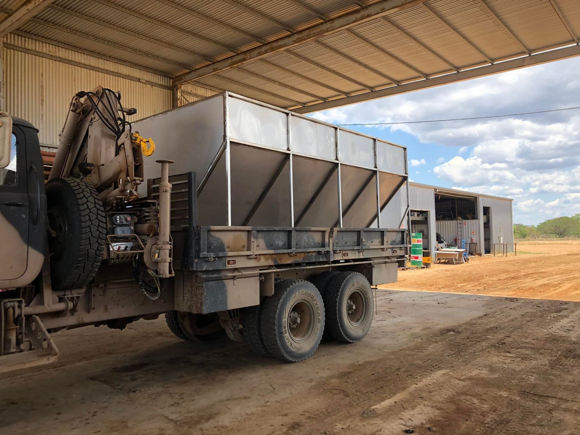 A Truck Carrying a Large Metal Container in a Rural Shed — Australian Mobile Welding Pty Ltd in Atherton, QLD