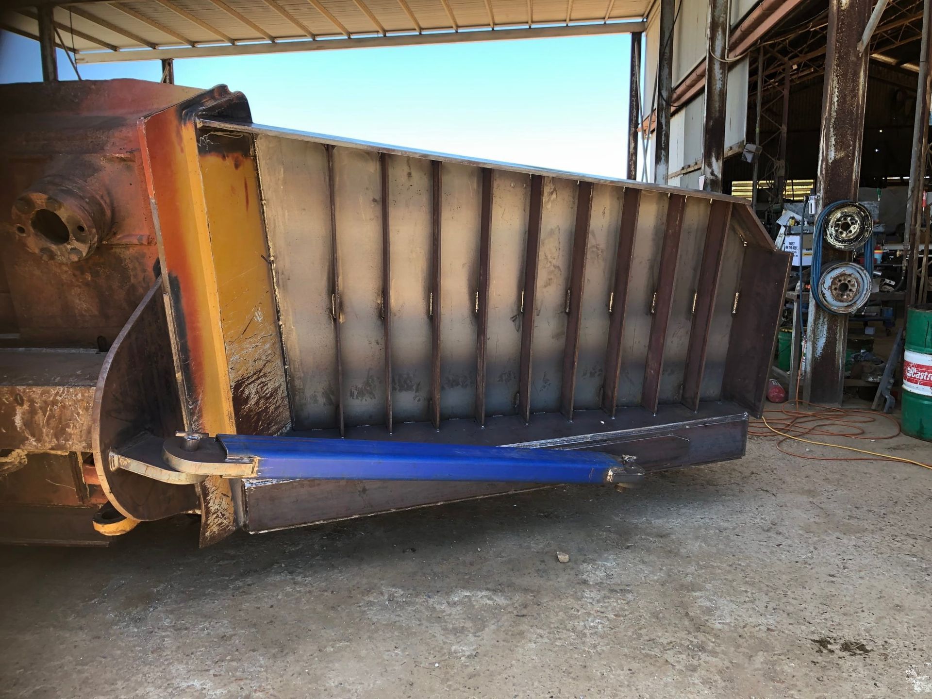 A Large Metal Farm Implement With a Blue Support Bar — Australian Mobile Welding Pty Ltd in Cooktown, QLD