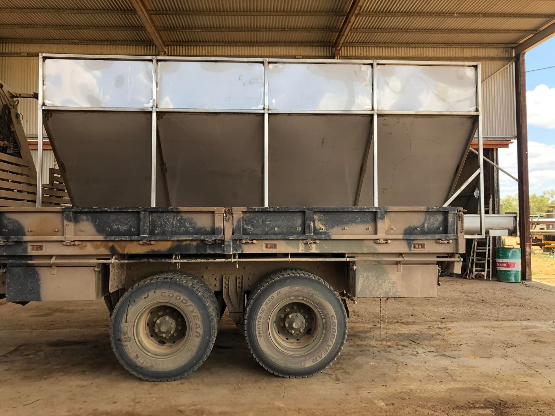 Truck bed with a large metal container for bulk material — Australian Mobile Welding Pty Ltd in Atherton, QLD