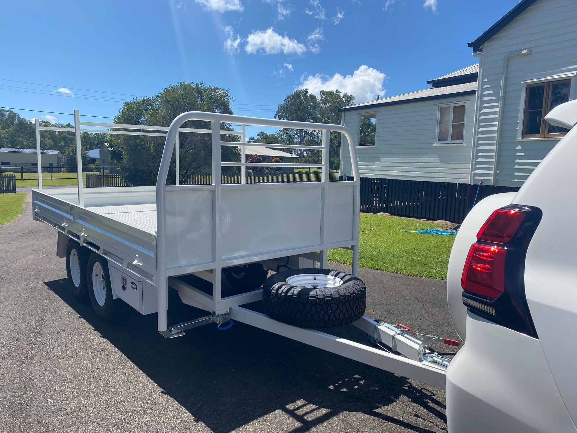 White Utility Trailer Attached to a White Car — Australian Mobile Welding Pty Ltd in Atherton, QLD