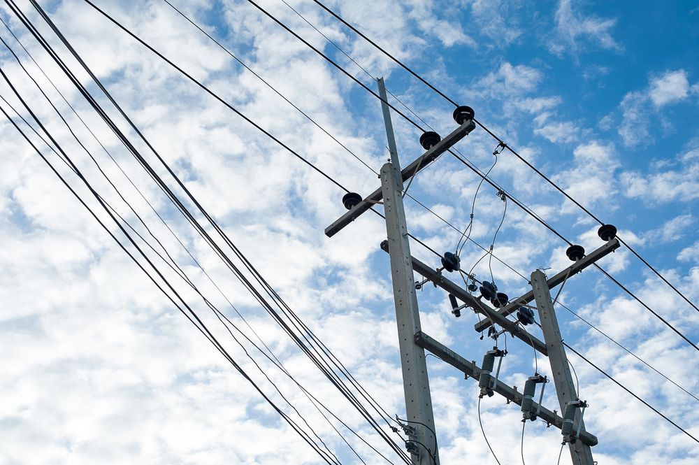 A Tall Power Line With White Clouds — Australian Mobile Welding Pty Ltd in Atherton, QLD