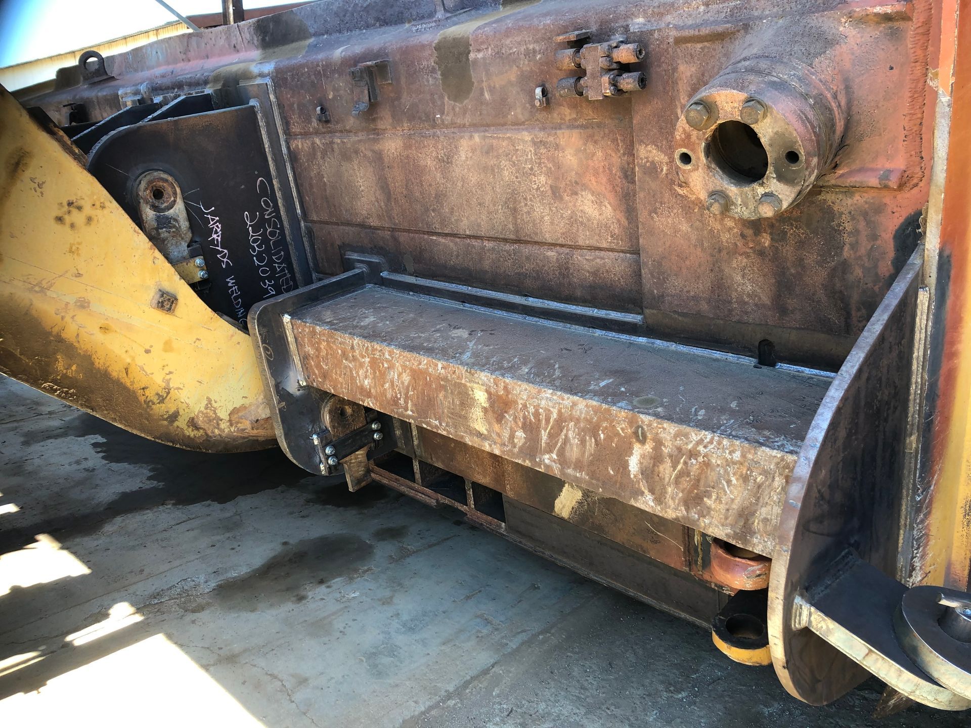 Stone wall with ornate metal gate and driveway leading to a grassy area. Hilly background under a blue sky — Australian Mobile Welding Pty Ltd in Georgetown, QLD