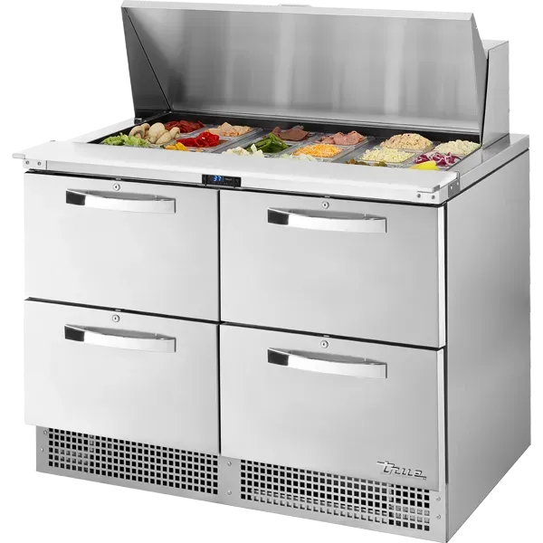 Stainless steel refrigerated food prep table with open lid and drawers.