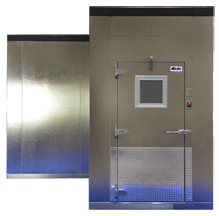 Walk-in cooler with a door, metal panels, and a window. The floor has a blue glow.