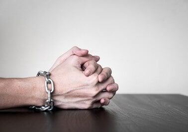 Close up of Male hands with chain - Bail Bonds in Houston, TX