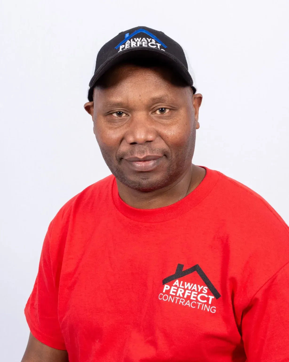 Man wearing a cap and red shirt with 