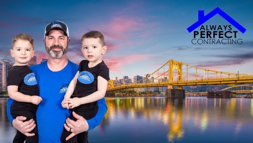 Man holding two children in front of a bridge; company logo for Always Perfect Contracting.