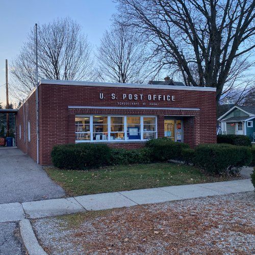 A brick building with a sign that says u.s. post office
