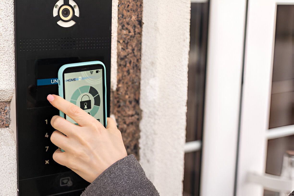 A person is using a smart phone to open a door.