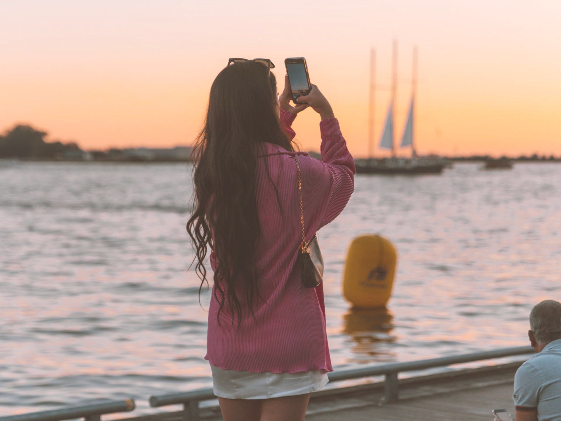 Woman Photographing the Sunset