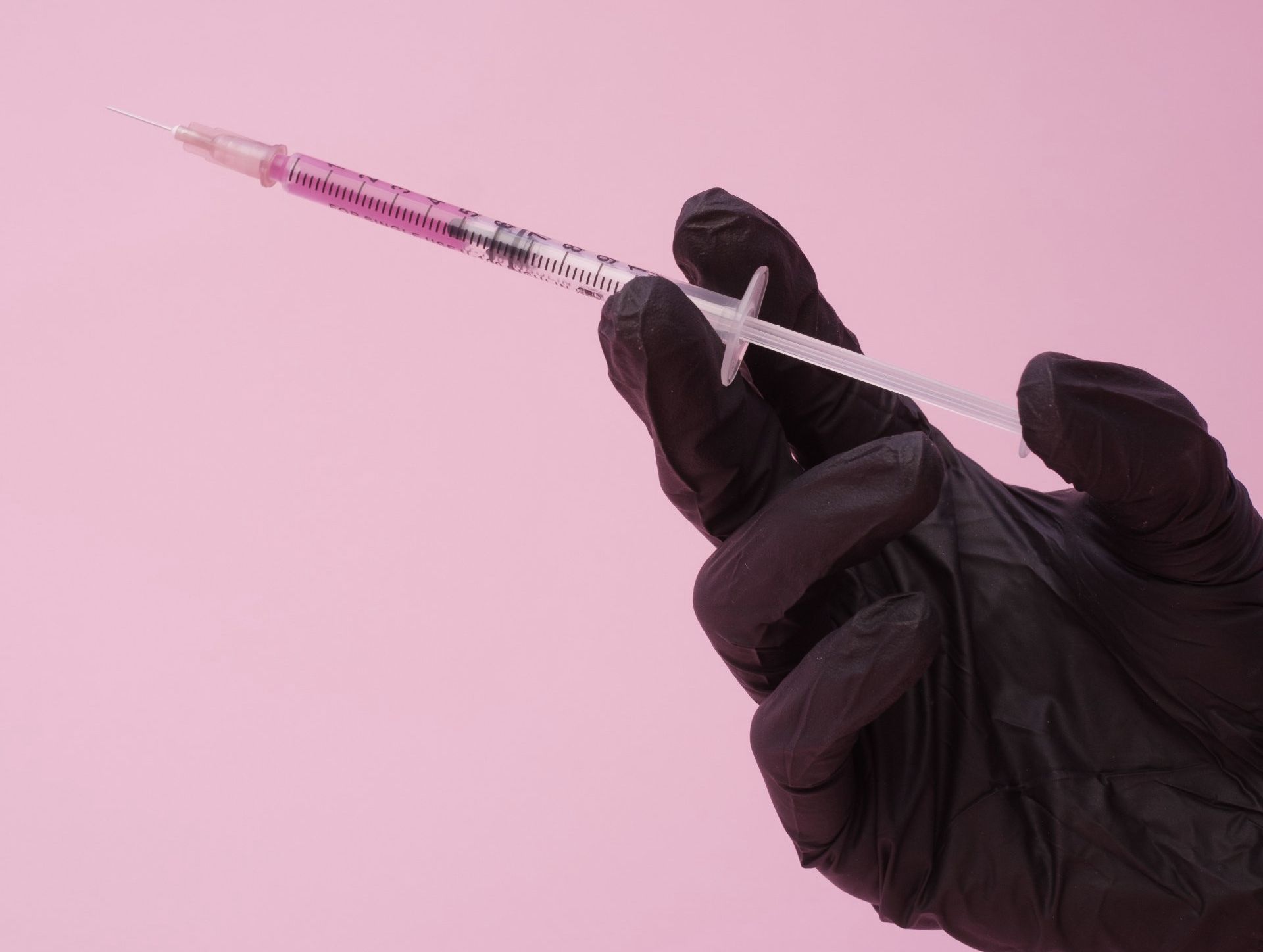 Hand Holding Syringe