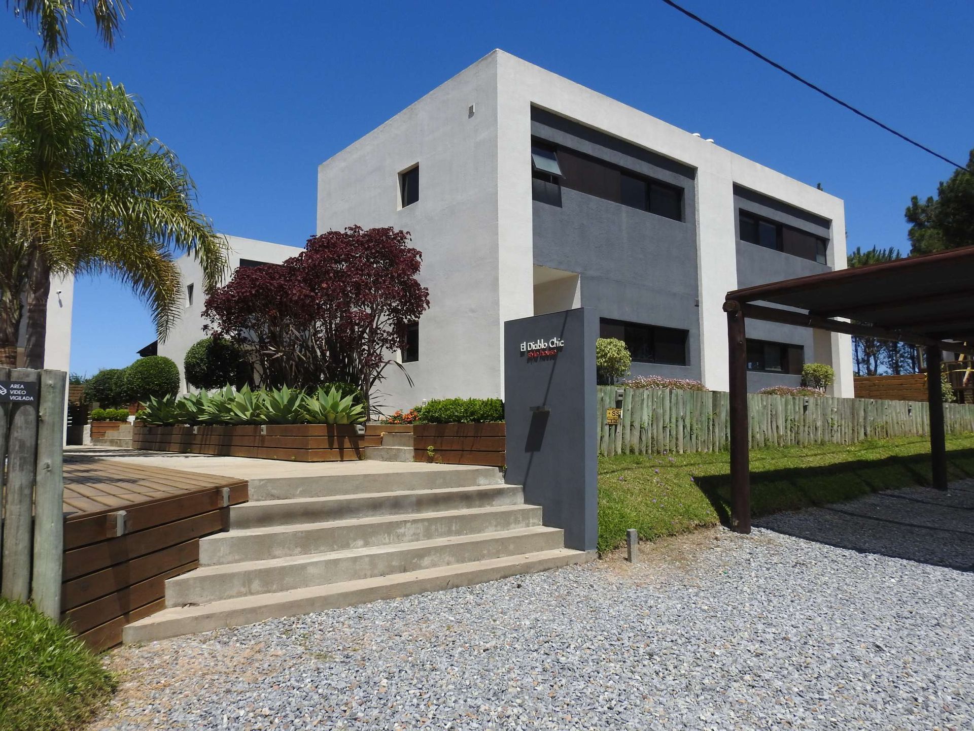 A large white building with stairs leading up to it