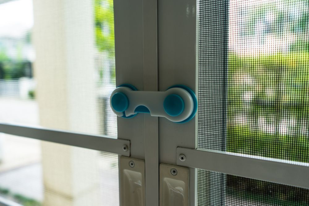 White and Blue Plastic Child-safety Lock Secured — Suburban Security Screens in Currumbin, QLD