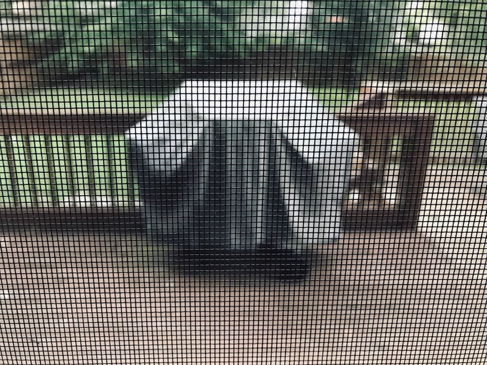 Grey Covered Outdoor Grill Sits on a Wooden Deck — Suburban Security Screens in Currumbin, QLD
